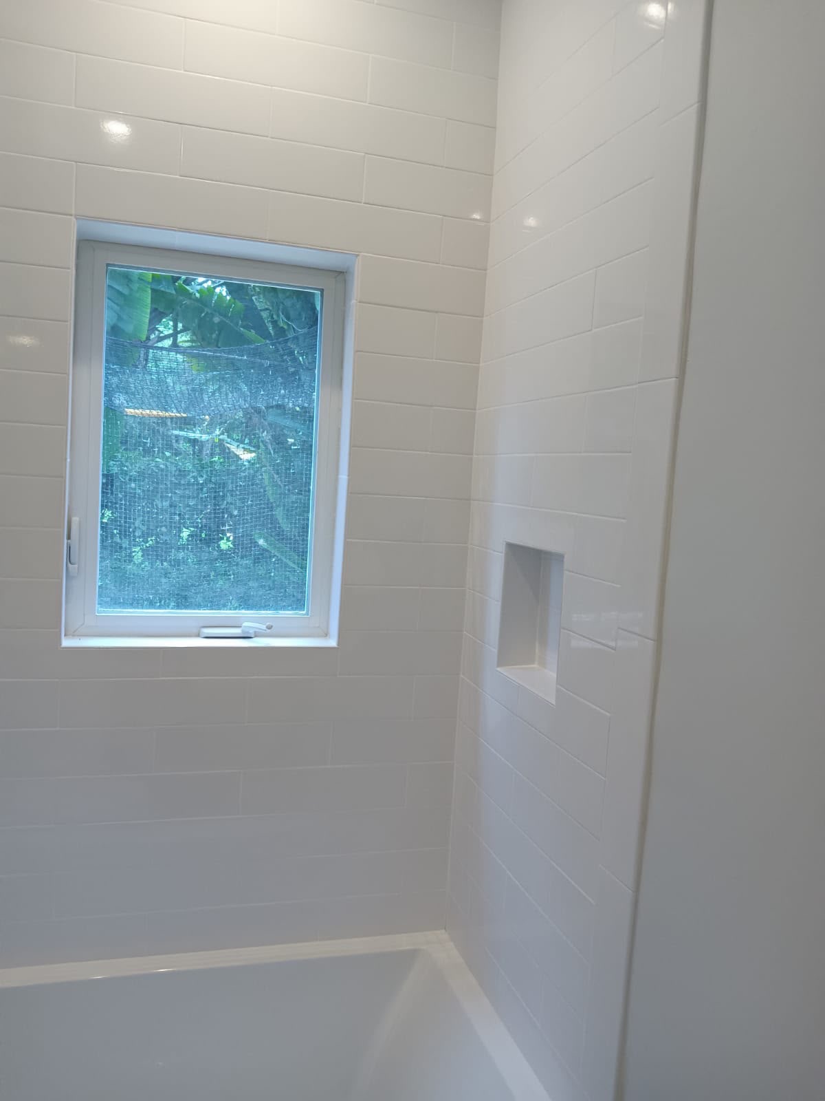 Subway Tile Shower with Window and Niche